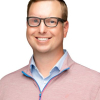 Mark F. looking forward wearing glasses and a zip up